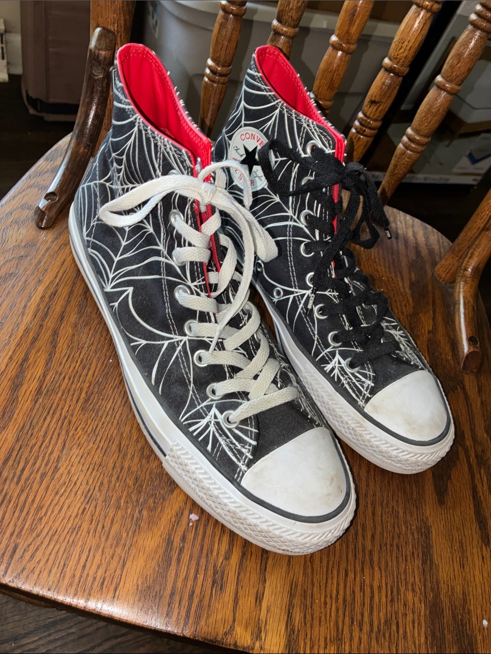 Converse Black High Top Sneakers with White Spiderweb Print and Red Lining